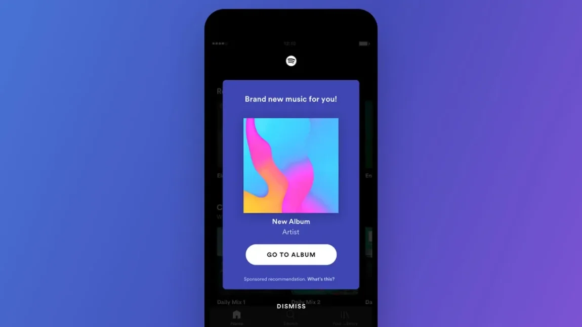 Close-up of a smartphone screen showing Spotify's RapCaviar playlist with the song 'Headshot' by Lil Tjay, Polo G, and Fivio Foreign currently playing.